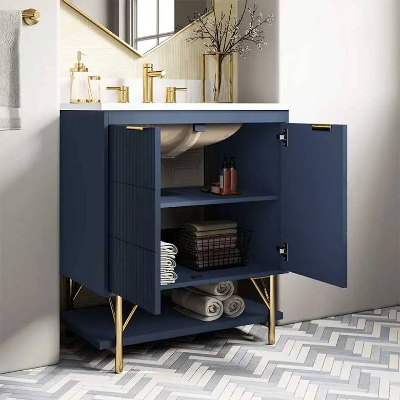 Modern bathroom vanity with a blue base, gold accents, and open shelves for towels and accessories