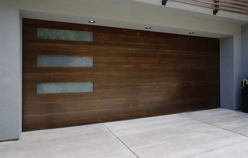 Modern wooden garage door with three horizontal frosted glass panels on the left