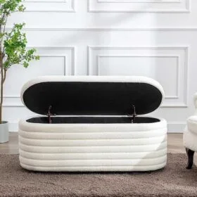 White upholstered storage bench with an open lid in an elegant living space