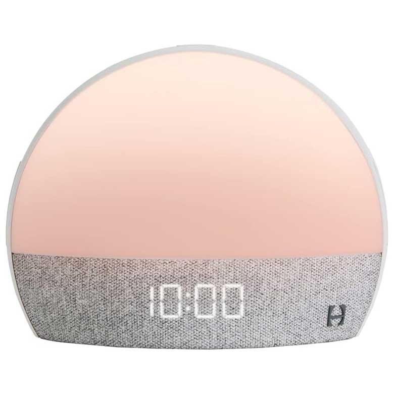 Sunrise alarm clock with soft gradient light and digital time display on a fabric-covered base
