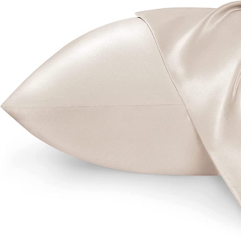 Beige silk pillowcase with a smooth, shiny finish