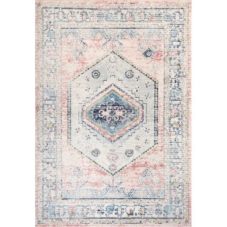 Pastel pink, blue, and white geometric patterned rug with a distressed vintage look