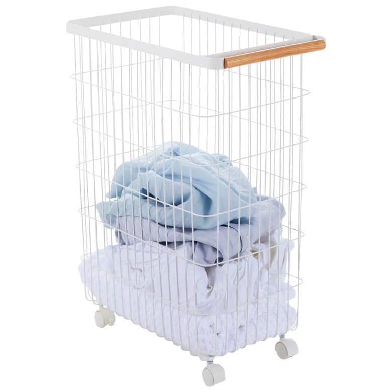 White wire laundry basket with wood handle and wheels