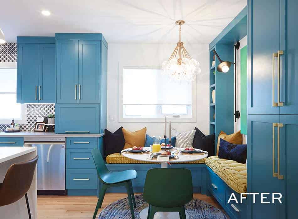 Cozy kitchen nook with built-in blue cabinetry, a round dining table, and a cushioned bench