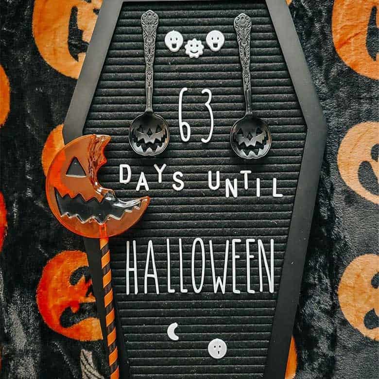 Halloween countdown board with pumpkin decor and spoons