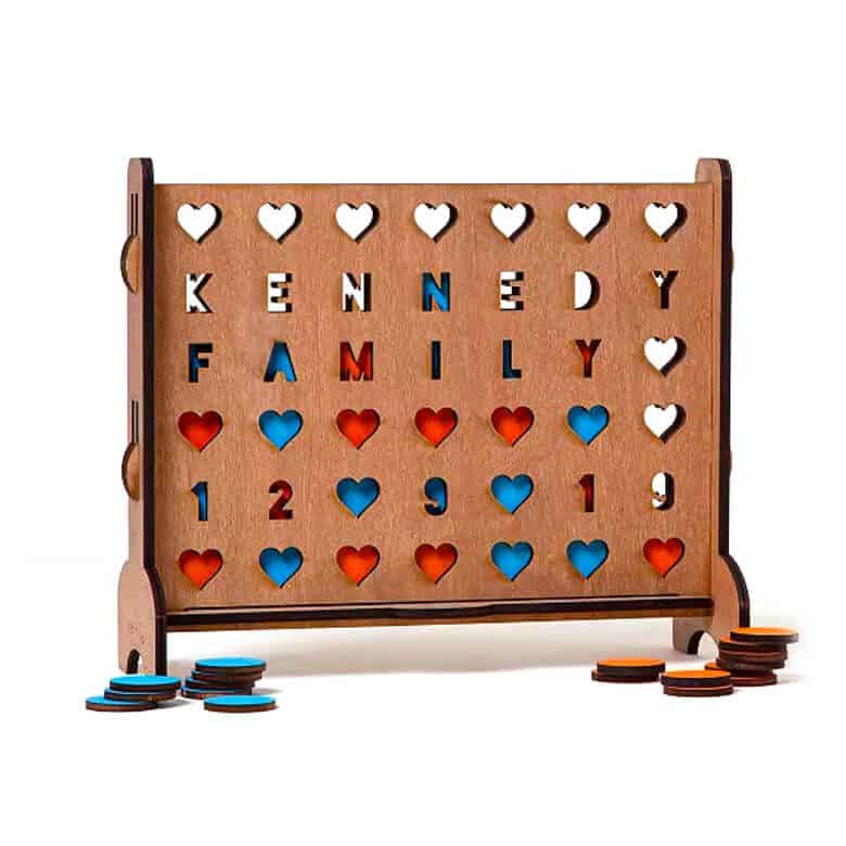 Custom-made Connect Four game board with the last name "KENNEDY" and the word "FAMILY" written across the top