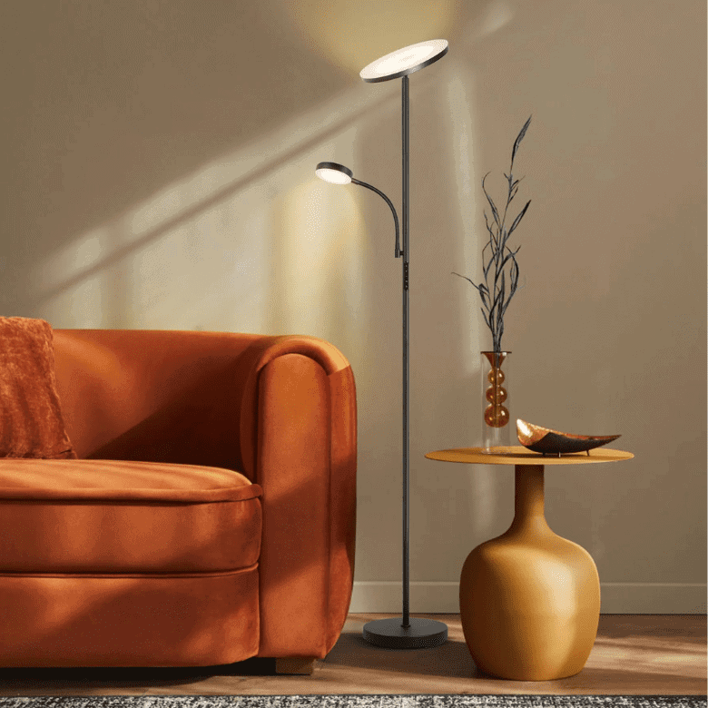 Cozy living area with an orange couch, modern floor lamp, and a stylish side table