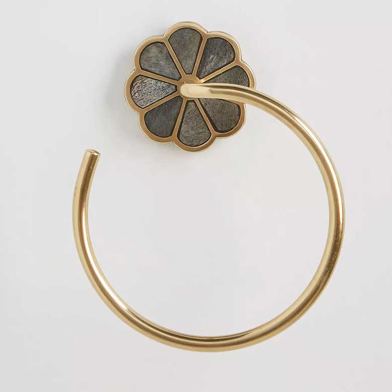 Gold towel ring with a flower-shaped backplate
