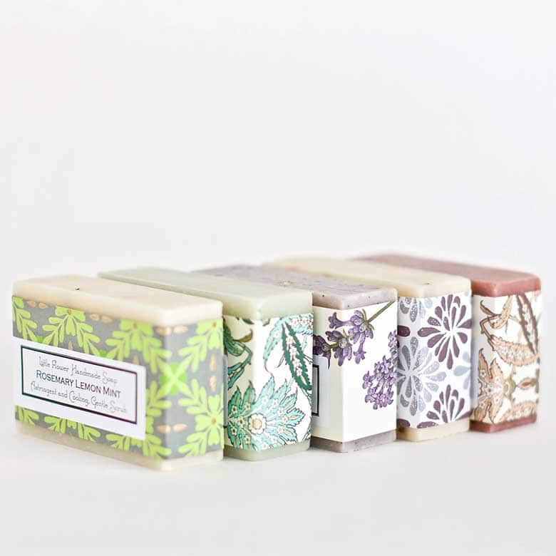 Handmade soap bars wrapped in floral-patterned paper