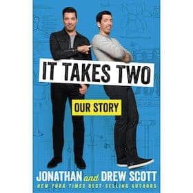 Book cover for *It Takes Two: Our Story* by Jonathan and Drew Scott, featuring the authors on a blue background