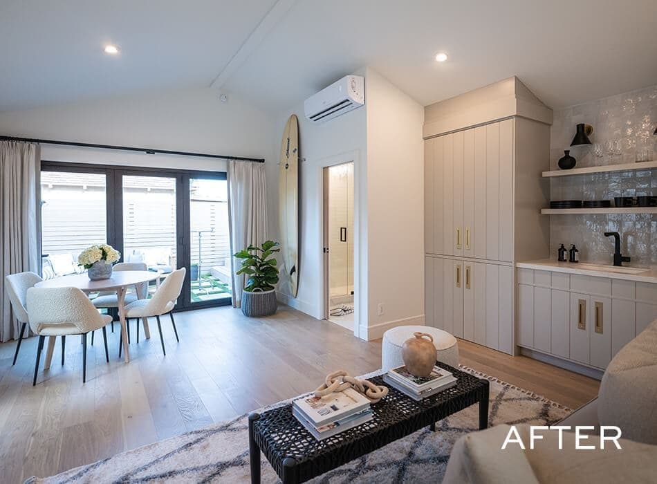 Open-concept living space with modern furnishings, built-in cabinetry, and a dining area