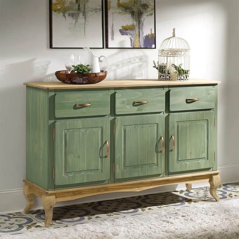 Green wooden sideboard with drawers and cabinets on patterned tile floor