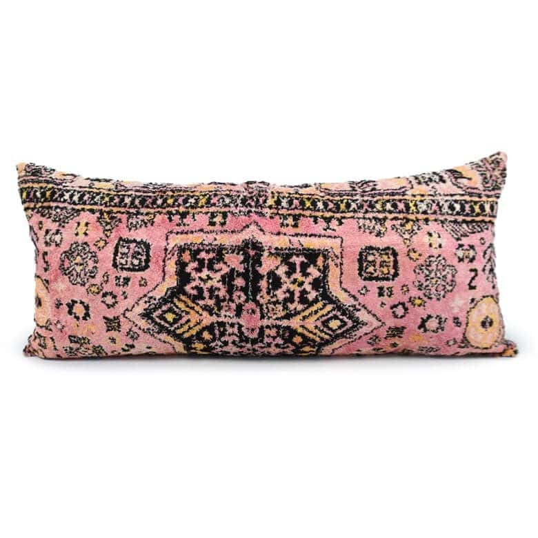 Pink rectangular pillow with a vintage-inspired ornate pattern