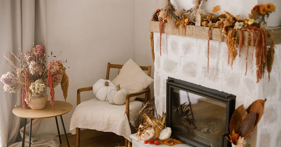fall fireplace mantel decor with cozy pumpkin pillows