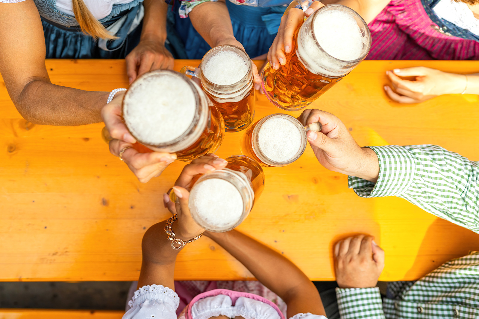 group of friends cheering with beer for oktoberfest