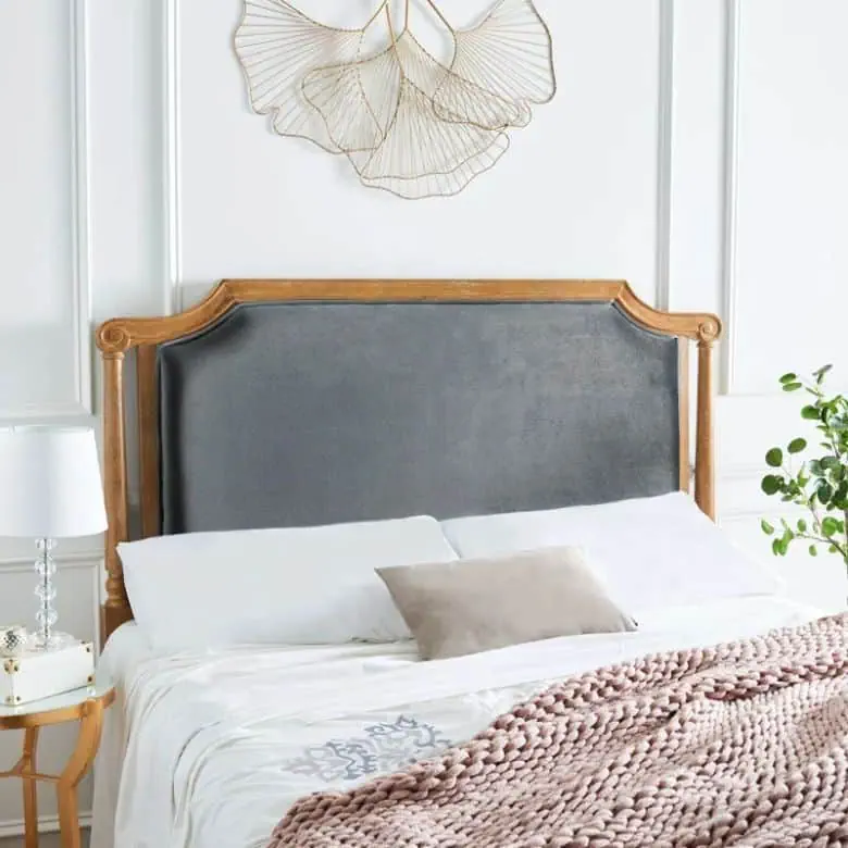 gray upholstered headboard with wood detailing