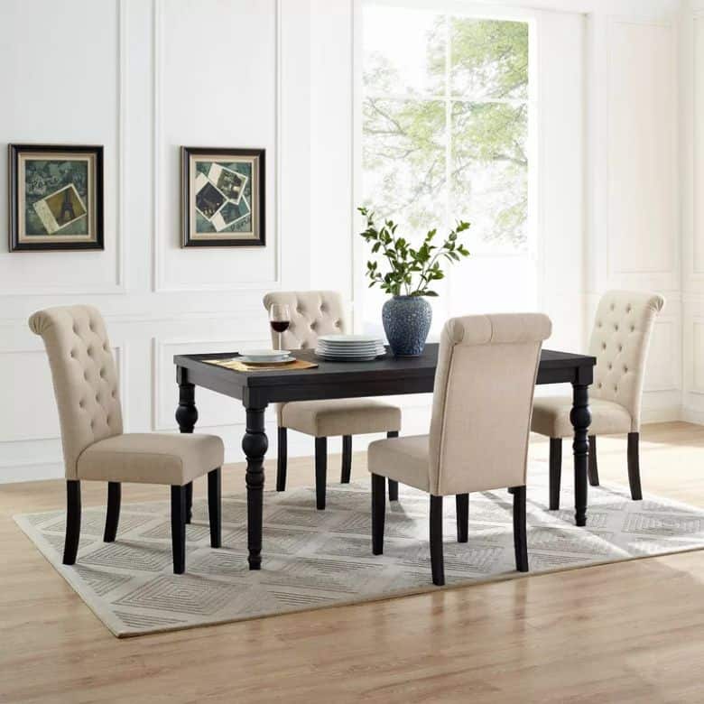 black rectangle dining table with cream chairs