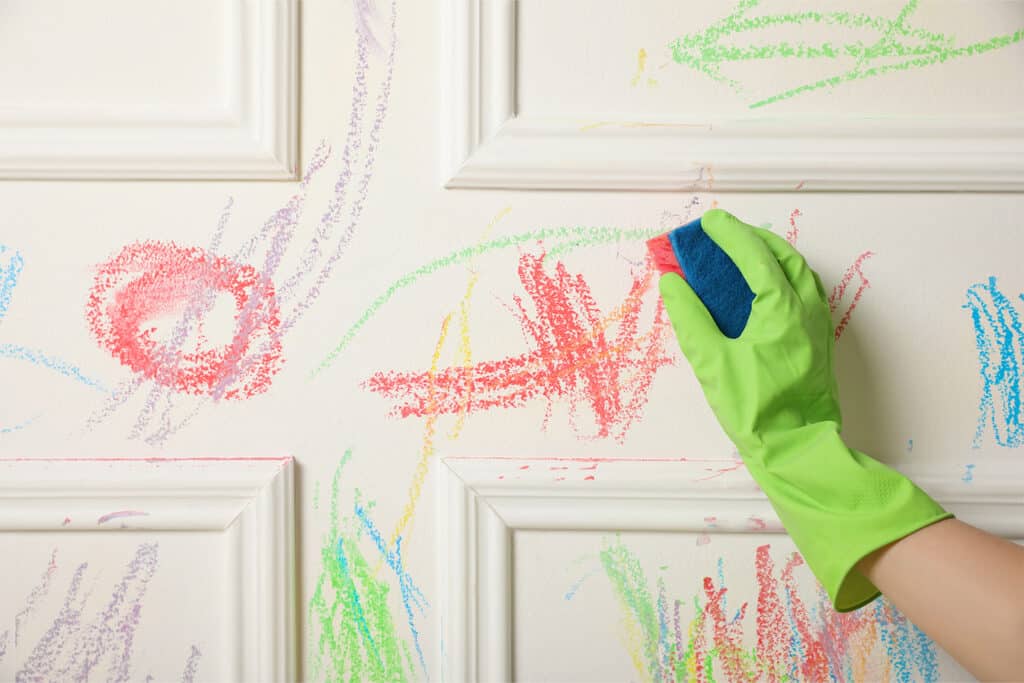 how to get crayon off of a wall, cleaning wall with glove and sponge