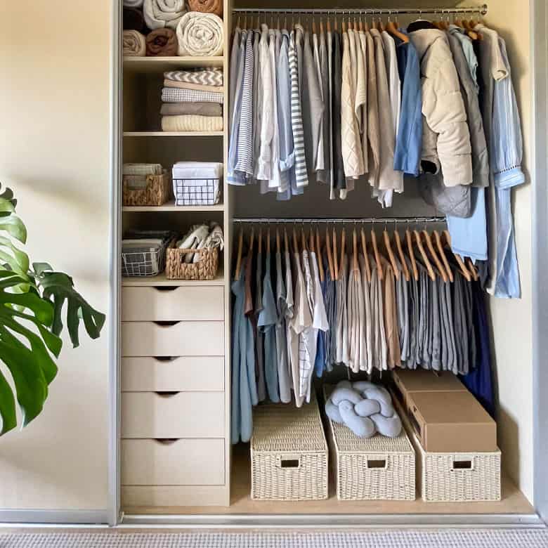 organized closet with storage for items and neat clothing