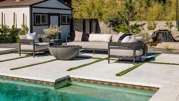 Seating area by fire pit and coy pond
