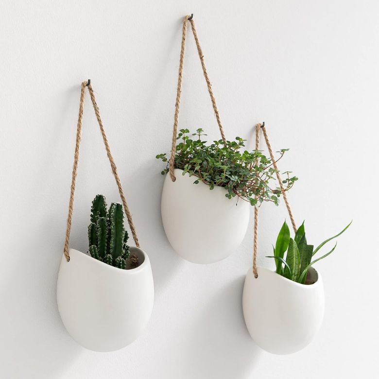 white wall hanging planters