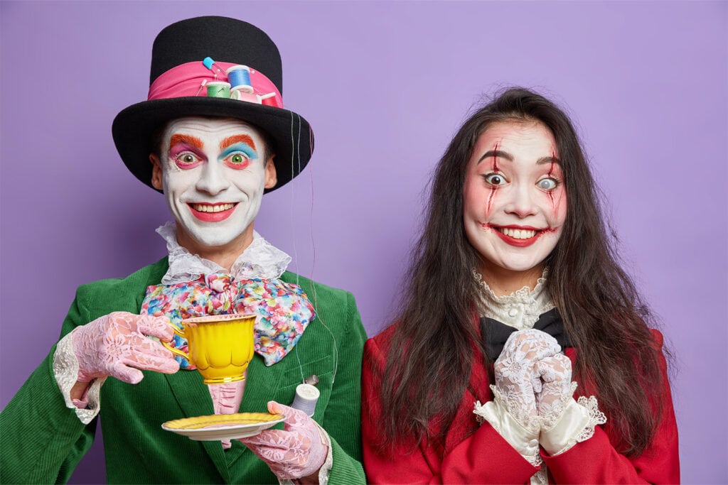 couple dressed up as alice in wonderland characters