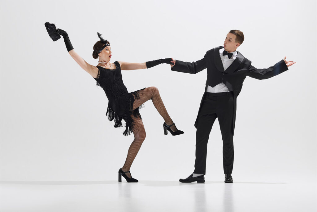 man and woman dressed up like the 1920s