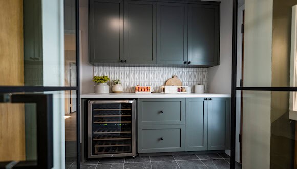 Green cabinets and wine fridge
