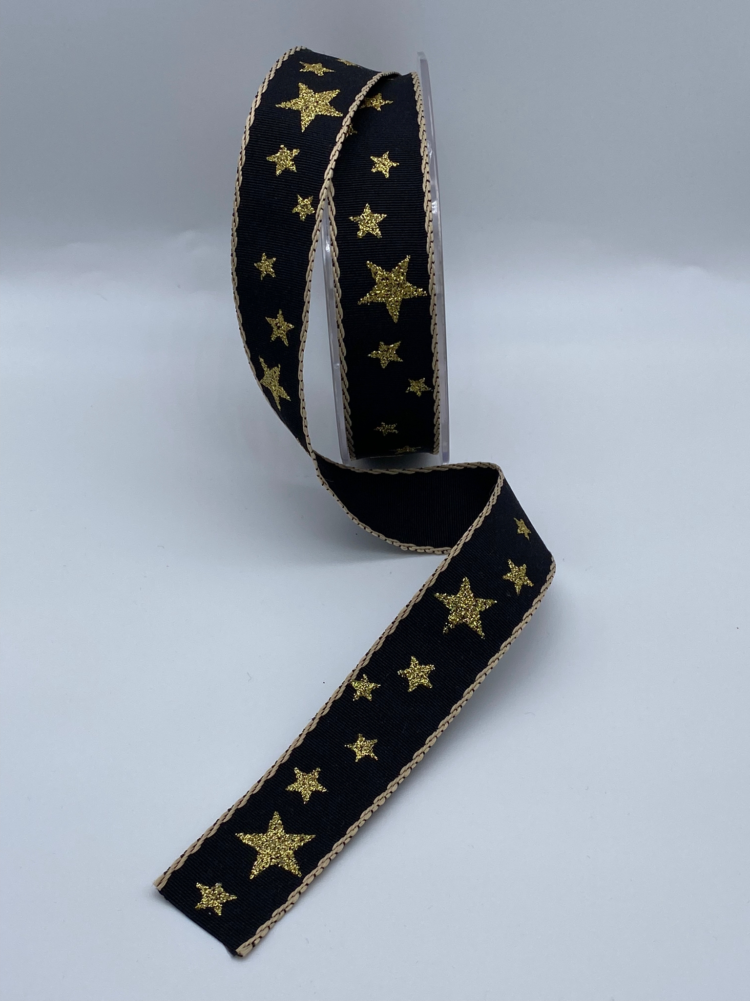 Gold stars on Black Ribbon - 25mm - per metre *