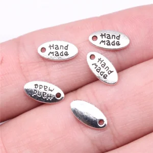 Handmade Oval Charm Tag 11mm x 6mm Antique Silver per piece