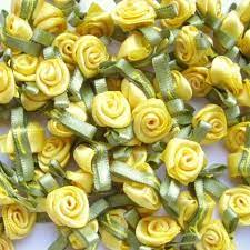 Small sunshine yellow ribbon roses with leaves