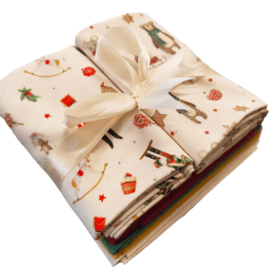 1/2 m patterned organic cottons with Christmas toys, nut crackers, mice and bears with 4 plain coloured fat quarters in a bundle with satin ribbon bow