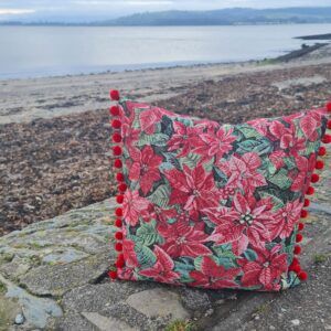 Cushion kit Poinsettia tapestry with red green tartan style back, zip and pom pom trim *