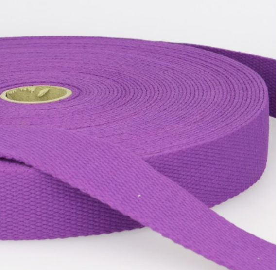 Purple woven ribbon for craft and sewing projects, high-quality fabric accessory from Fabric & Finery UK.