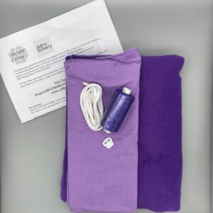 Purple recycled fabric sewing kit with cord, thread, and instructions for DIY reversible headband from Fabric & Finery UK, ideal for sustainable fashion projects.