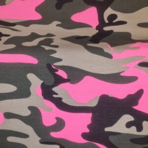 Vibrant pink, black, and grey camouflage fabric pattern, perfect for fashion and upholstery projects. High-quality textile material from Fabric & Finery's collection, blending style with durability.