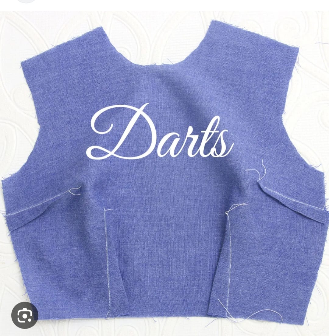 Darts on a blue fabric pattern for tailored sewing, dressmaking, and bespoke garments. Perfect for creating structured clothing with precision and professional finish.