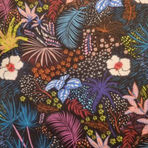 Vibrant tropical floral fabric with colourful leaves, flowers, and butterflies, perfect for home décor and textile projects from Fabric & Finery.