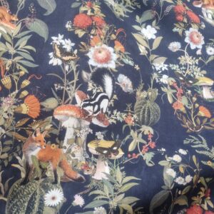 Vibrant botanical fabric with woodland animals, mushrooms, and butterflies, perfect for lush upholstery, fashion, or home décor projects. Features detailed floral and fauna design on dark background.
