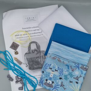 Colourful fabric swatches including blue, patterned, and textured textiles for sewing and craft projects at Fabric & Finery. Perfect for dressmaking and creative DIY projects.