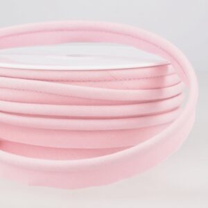 Soft pastel pink bias binding fabric for sewing and dressmaking projects at Fabric & Finery, perfect for finishing edges with a professional look.