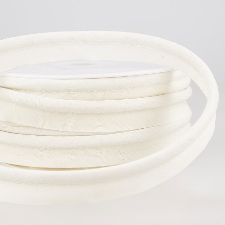 Soft white piping trim suitable for upholstery, dressmaking, and craft projects from Fabric & Finery. Perfect for adding finishing touches to garments and home textiles.