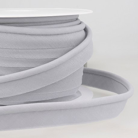 Soft grey bias tape for sewing and tailoring, high-quality finish for garments and craft projects.