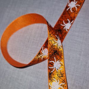 Halloween Double Satin Ribbon 25mm, white spiders on orange, per metre