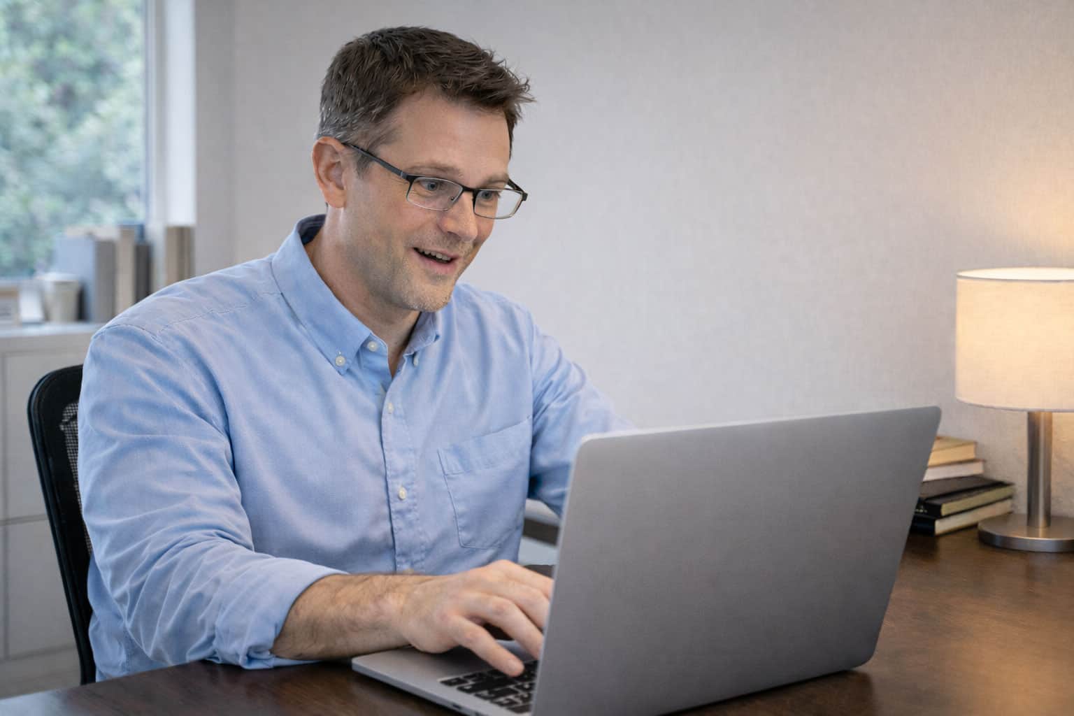 Professional reviewing enrollment deadline on calendar in Anchorage office