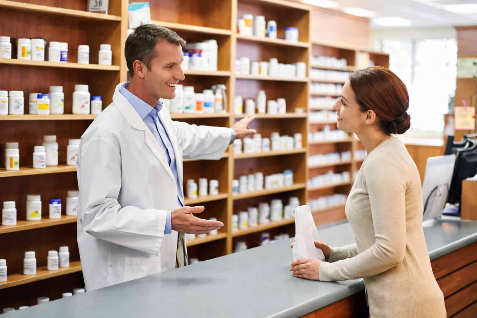 Pharmacist helping customer at an Arkansas pharmacy counter