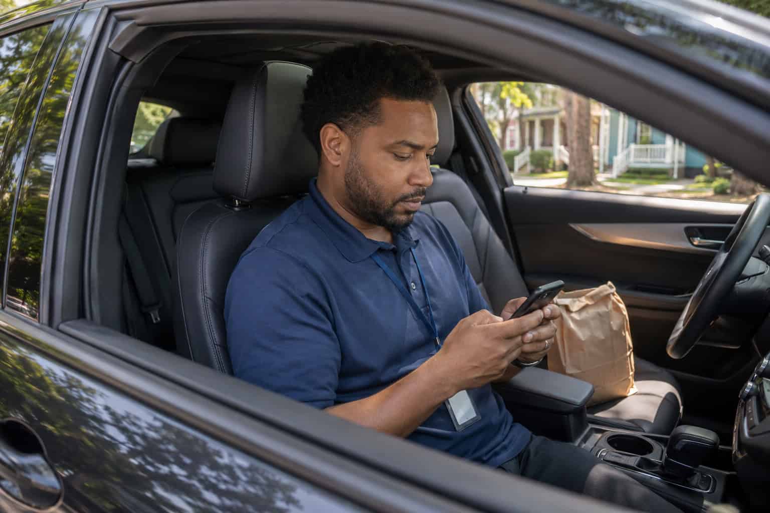  Affordable health insurance Louisiana — New Orleans resident comparing 2026 plan options on a phone during a lunch break