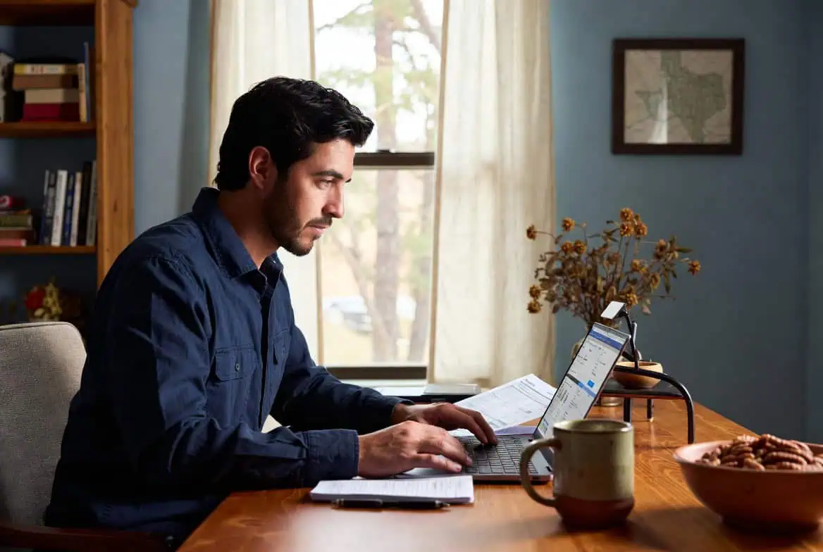  Tyler East Texas resident reviewing individual health insurance plan options on a laptop at a home office desk