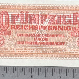 50 Reichspfennig German currency note from WWII, featuring intricate design and historical significa.