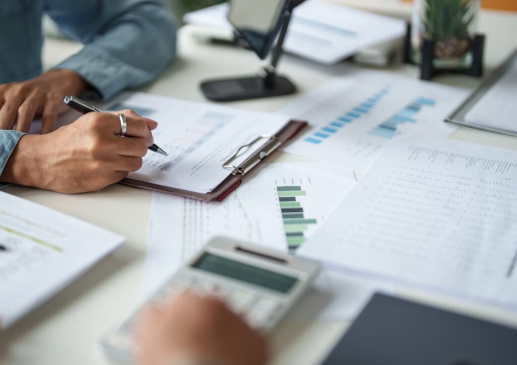 Financial adviser reviewing investment portfolio documents